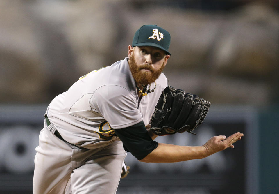 Oakland Athletics starting pitcher Dan Straily follows through on a delivery to the Los Angeles Angels during the first inning of a baseball game Tuesday, April 15, 2014, in Anaheim, Calif. (AP Photo/Jae C. Hong)