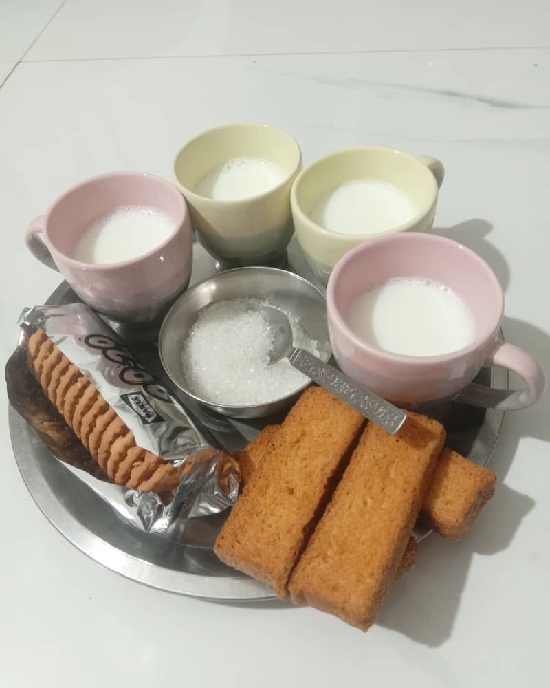 milk with rusk and biscuits