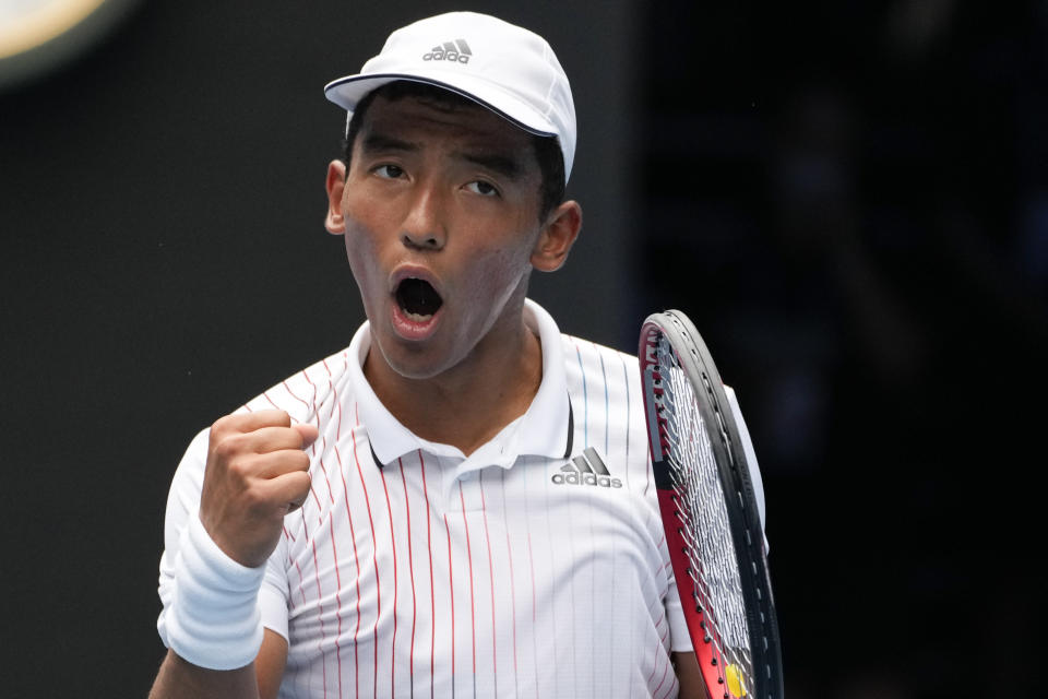 Bruno Kazuhara of the U.S. reacts after winning a point against Jakub Mensik of the Czech Republic in the boys' singles final at the Australian Open tennis championships on Saturday, Jan. 29, 2022, in Melbourne, Australia. (AP Photo/Mark Baker)