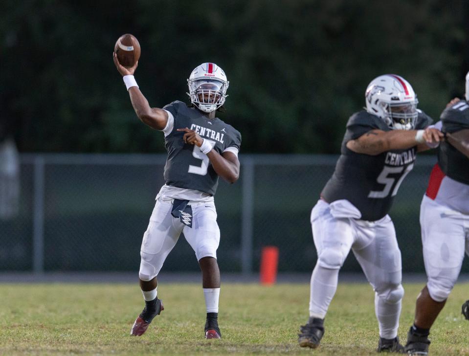 Palm Beach Central quarterback Ahmad Haston throws the ball Friday against Wellington.