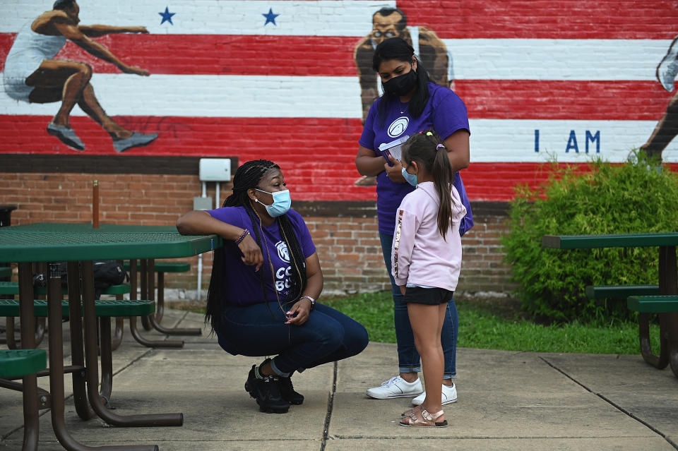 Cori Bush as a then-candidate speaks to a young supporter during a canvassing event on August 3, 2020 in St Louis, Missouri.  (Photo by Michael B. Thomas/Getty Images)