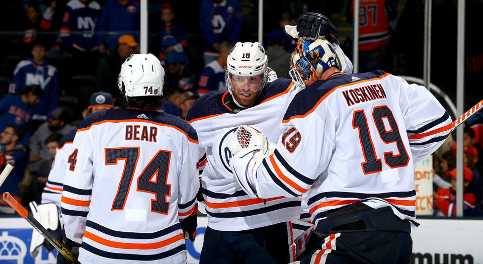 NEW YORK, NEW YORK - OCTOBER 08:  James Neal #18 and Mikko Koskinen #19 of the Edmonton Oilers celebrate their teams 5-2 win over the New York Islanders during the third period at NYCB Live's Nassau Coliseum on October 08, 2019 in Uniondale, New York. (Photo by Mike Stobe/NHLI via Getty Images)