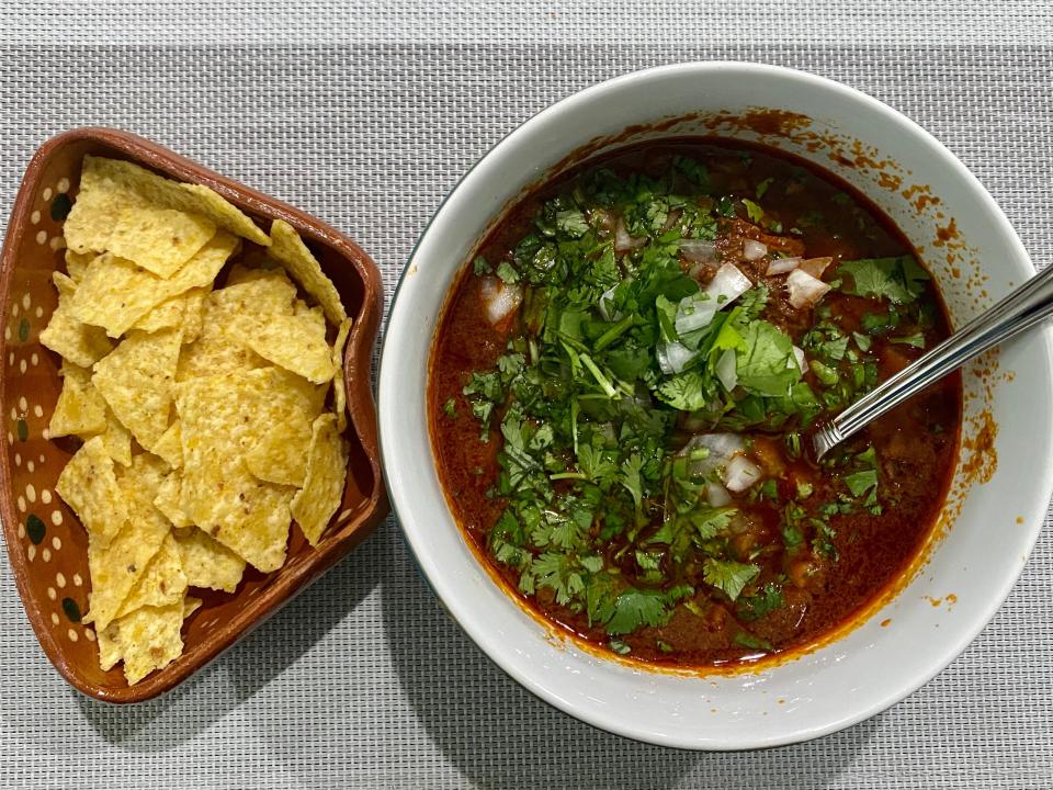 Birria with side of tortilla chips.