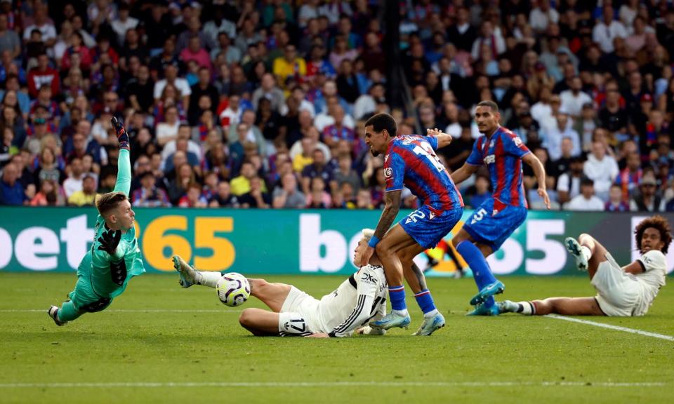 <span>Crystal Palace's Dean Henderson saves from Manchester United's Alejandro Garnacho.</span><span>Photograph: Peter Cziborra/Action Images/Reuters</span>