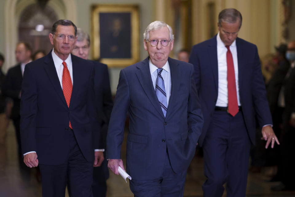 Senate Minority Leader Mitch McConnell, R-Ky., center, flanked by Sen. John Barrasso, R-Wyo., left, and Senate Minority Whip John Thune, R-S.D., arrives to speak to reporters after a Republican policy meeting, at the Capitol in Washington, Tuesday, Sept. 28, 2021. Yesterday, Republican senators blocked a bill to keep the U.S. government funded and allow borrowing. (AP Photo/J. Scott Applewhite)