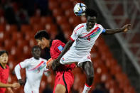 South Korea's Lee Young-jun, left, and Gambia's Alagie Saine battle for the ball during a FIFA U-20 World Cup Group F soccer match at the Malvinas Argentinas stadium in Mendoza, Argentina, Sunday, May 28, 2023. (AP Photo/Natacha Pisarenko)