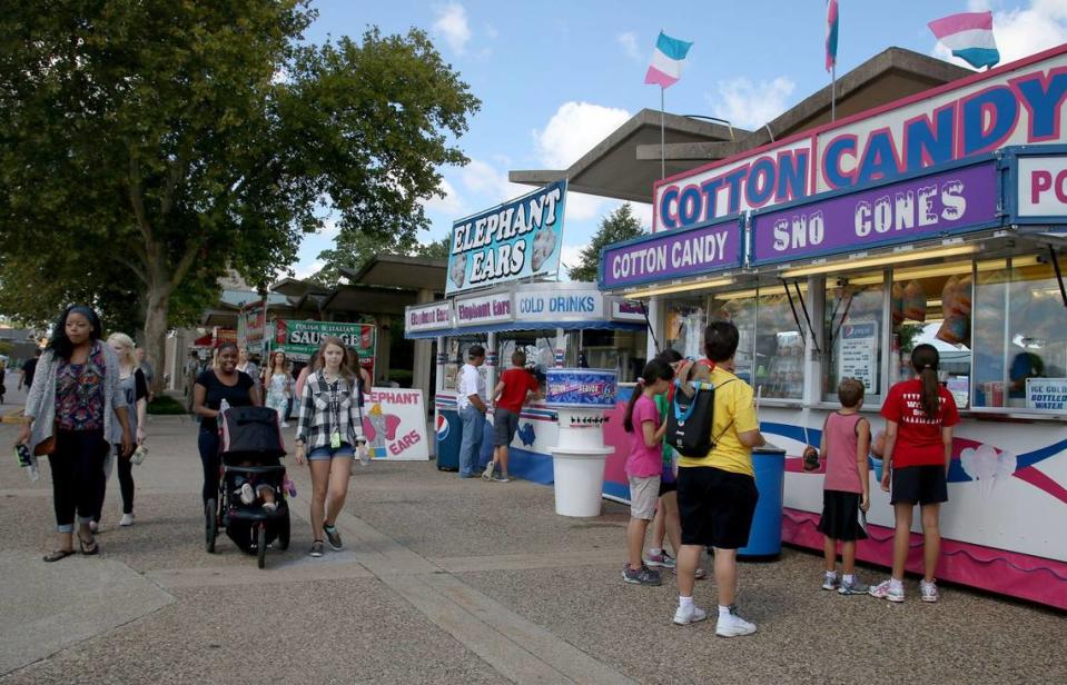 Cotton candy, corn dogs, and funnel cakes were among the many food options at the Kentucky State Fair in Louisville on Thursday, August 20, 2015. Photo by Andrea Noall | Staff