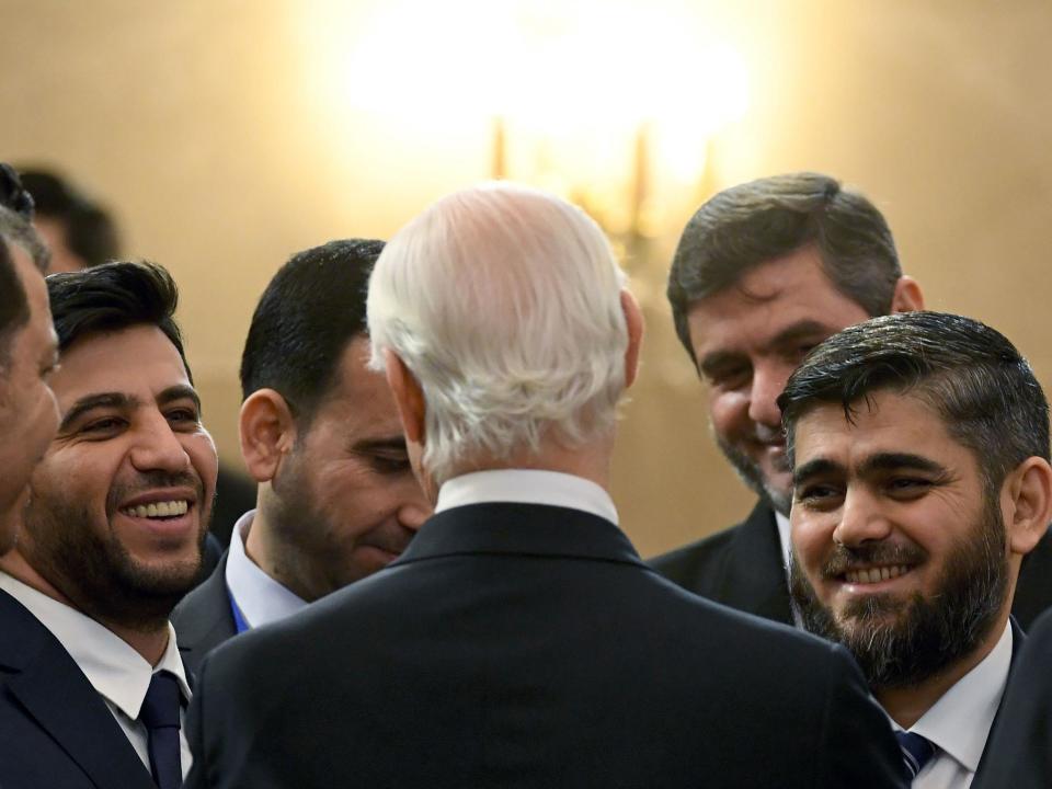 Chief opposition negotiator Mohammad Alloush (R) of the Jaish al-Islam (Army of Islam) rebel group listens to UN envoy for Syria Staffan de Mistura prior to the first session of Syria peace talks at Astana's Rixos President Hotel (Getty)