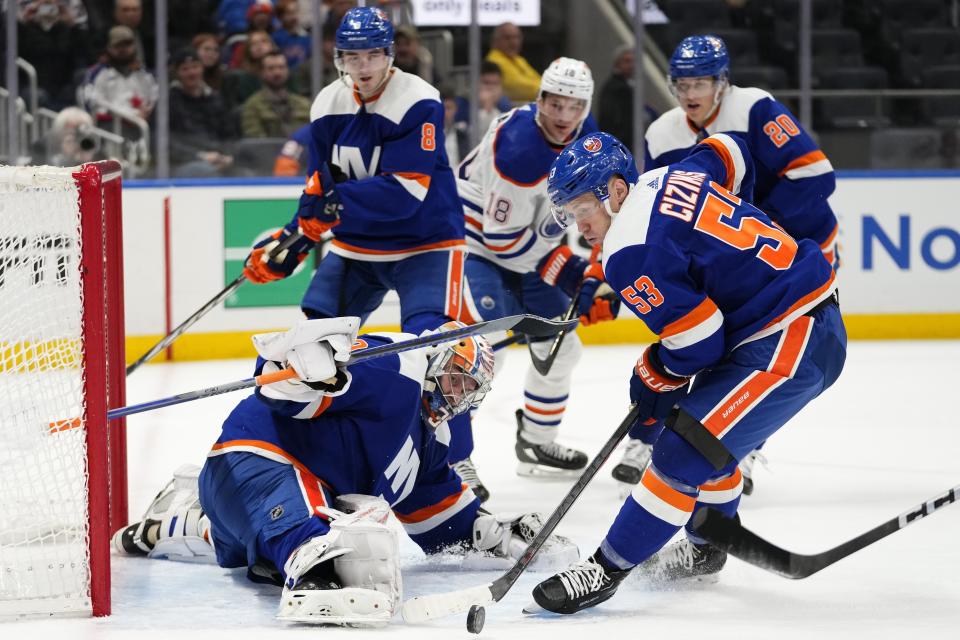 New York Islanders' Casey Cizikas (53) and goaltender Ilya Sorokin (30) protect the net during the first period of the team's NHL hockey game against the Edmonton Oilers on Tuesday, Dec. 19, 2023, in Elmont, N.Y. (AP Photo/Frank Franklin II)