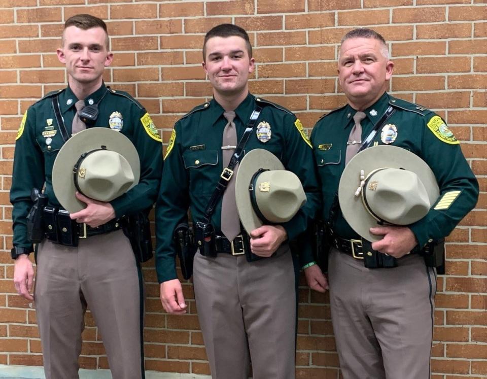 N.H. Troopers Cameron and Patrick Vetter pose for a photo with their dad, retired Capt. Christopher Vetter at Patrick's graduation from the NH Police Academy on Sept. 29.