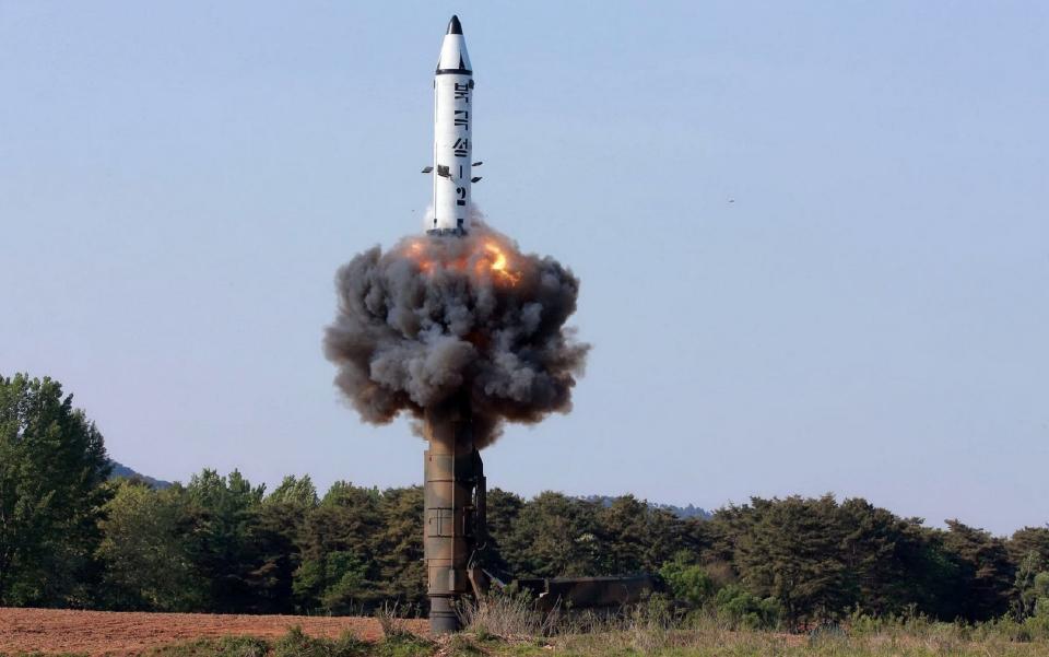 The North Korean ground-to-ground medium-to-long range strategic ballistic missile Pukguksong-2 being launched in a test-fire - Credit: KCNA/AFP