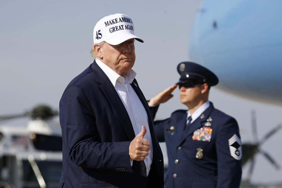 President Donald Trump gestures as he steps off Air Force One at Andrews Air Force Base, Md., Sunday, July 26, 2020. Trump is returning to Washington after spending the weekend at his golf club in Bedminster, N.J. (AP Photo/Patrick Semansky)