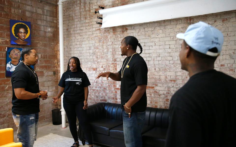 Jeanettea Traylor, LifeCoach, talks with PeaceMakers, Brandon Banks, right, Ka'Shez Coursey and Jabee Williams, executive director, at LiveFree in northeast Oklahoma City.