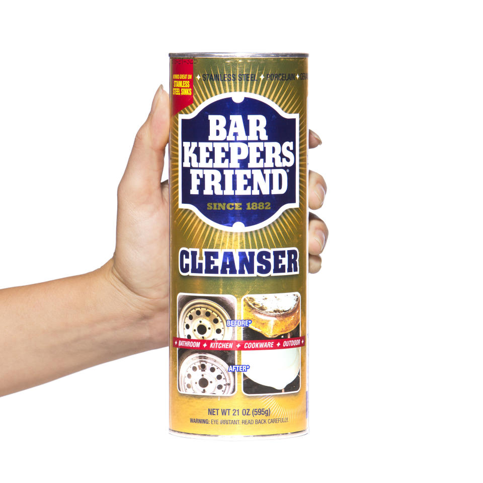 hand holding canister of bar keepers friend cleanser