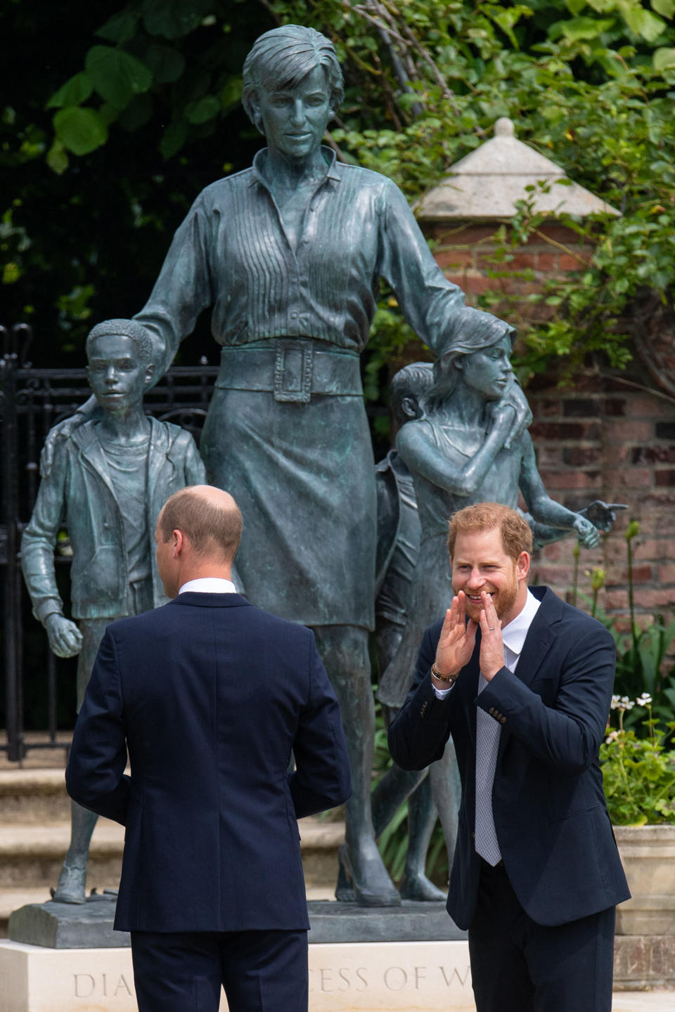 Britain's Prince William, Duke of Cambridge (L) and Britain's Prince Harry, Duke of Sussex unveil a statue of their mother, Princess Diana at The Sunken Garden in Kensington Palace, London on July 1, 2021, which would have been her 60th birthday. - Princes William and Harry set aside their differences on Thursday to unveil a new statue of their mother, Princess Diana, on what would have been her 60th birthday. (Photo by Dominic Lipinski / POOL / AFP) (Photo by DOMINIC LIPINSKI/POOL/AFP via Getty Images)