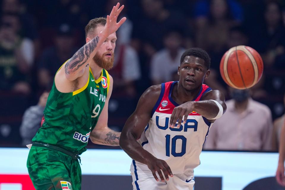 U.S. guard Anthony Edwards (10) makes a pass around Lithuania forward Ignas Brazdeikis (9) during their basketball World Cup second-round match in Manila, Philippines.