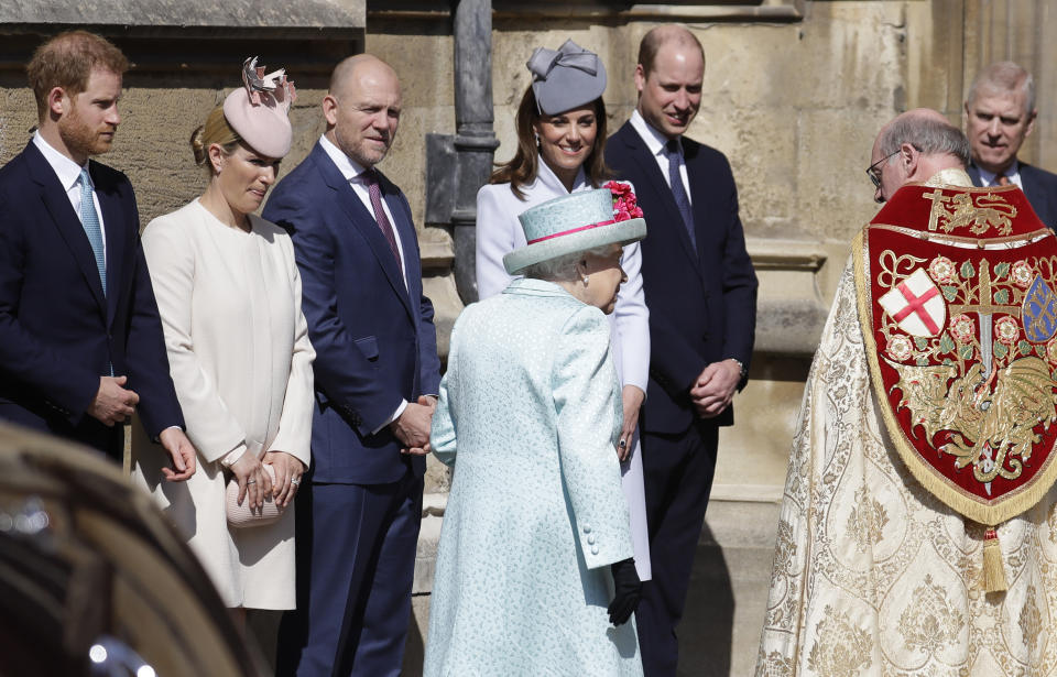 Members of Britain's Royal family watch as Britain's Queen Elizabeth II arrives to attend the Easter Mattins Service at St. George's Chapel, at Windsor Castle in England Sunday, April 21, 2019. (AP Photo/Kirsty Wigglesworth, pool)