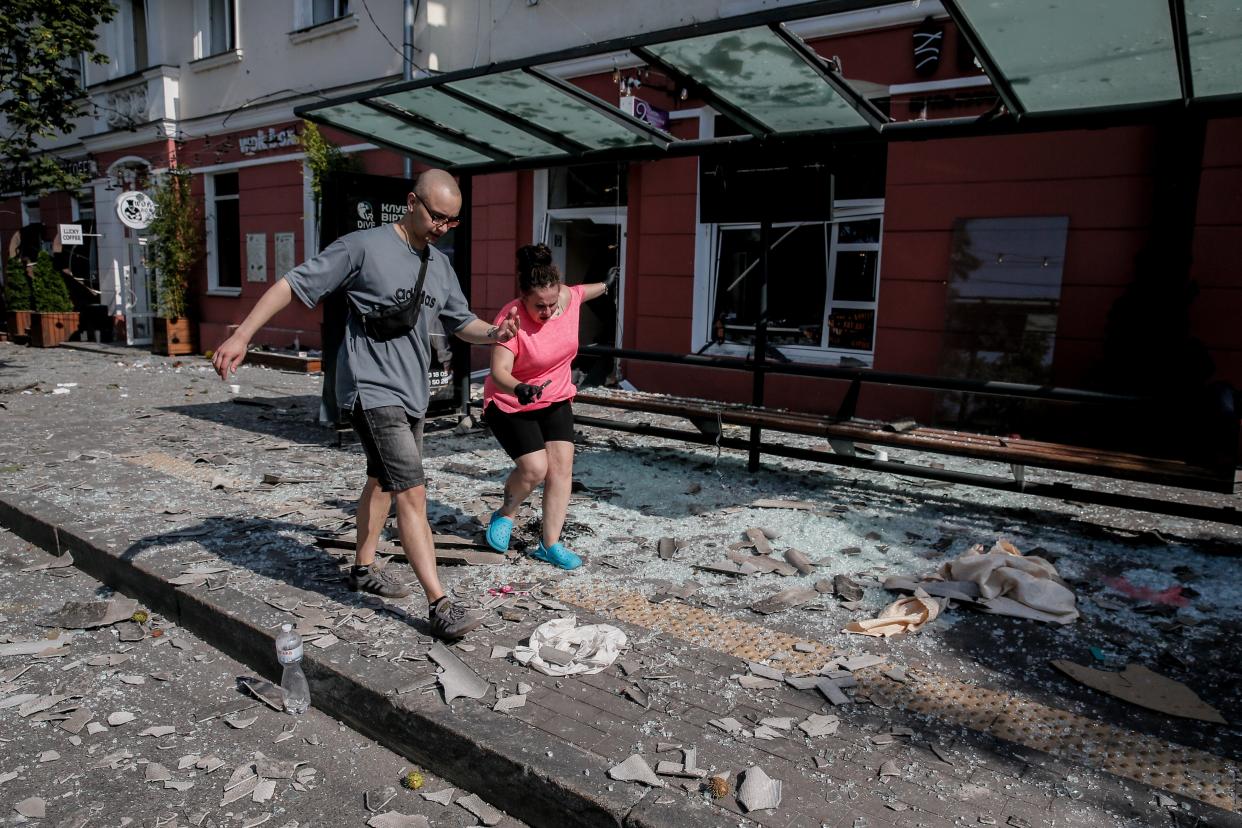 Debris in the street where a missile hit the Drama Theatre in central Chernihiv (EPA)