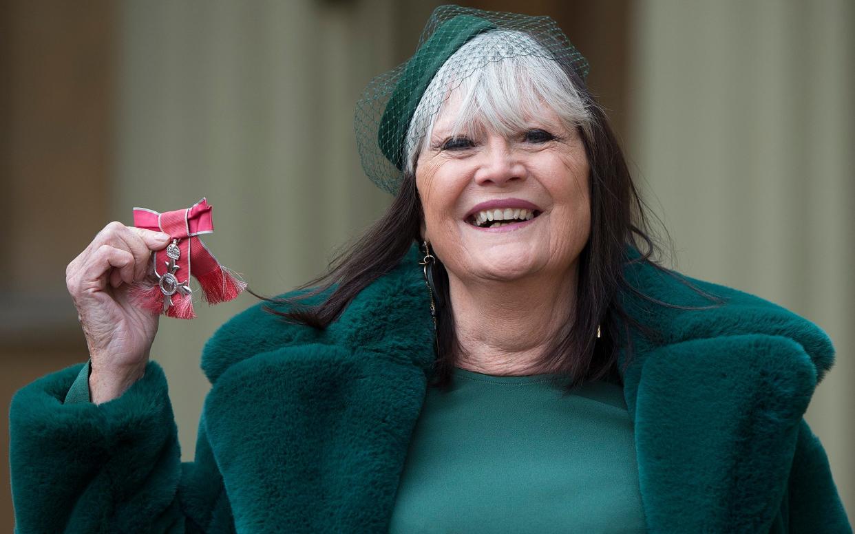 Sandie Shaw collecting her MBE for music in 2018 - Eddie Mulholland for The Telegraph