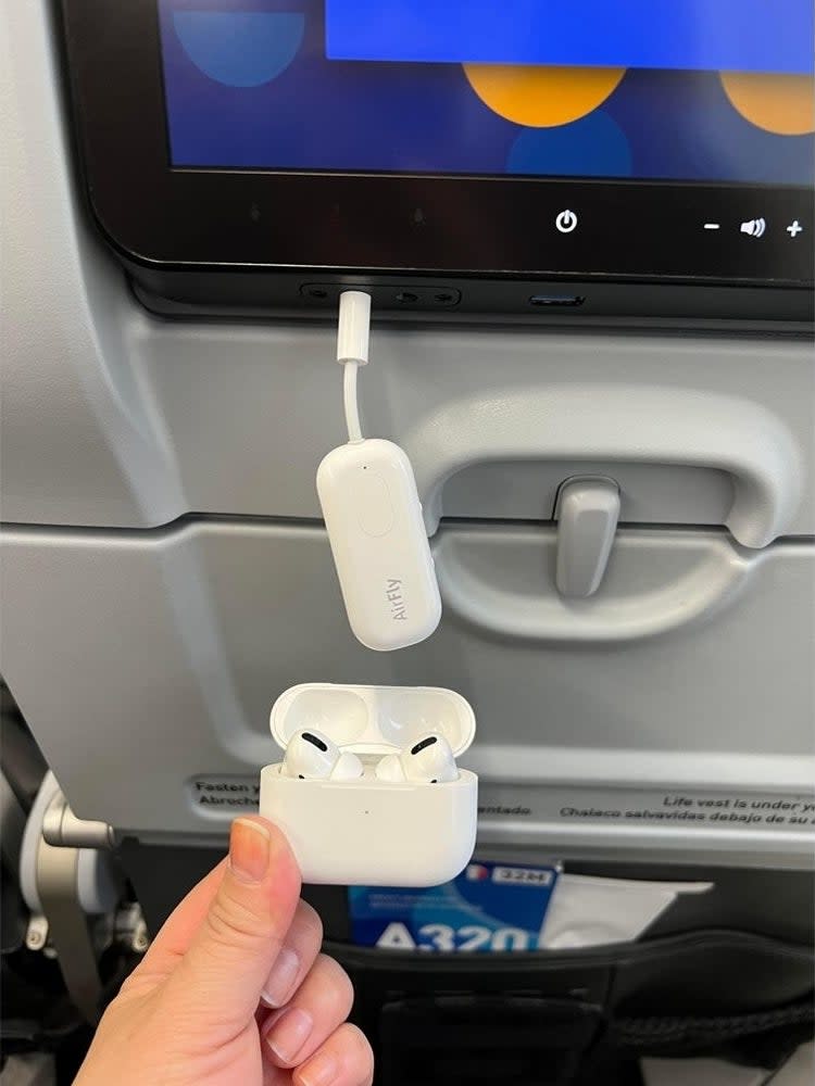 someone using the device on a plane so they can use their airpods