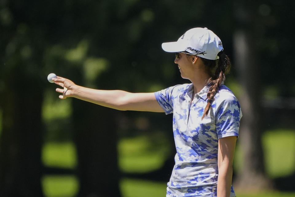 Roberta Liti, of Italy, holds out her ball on the seventh green during a practice round for the Womens PGA Championship golf tournament at Sahalee Country Club, Wednesday, June 19, 2024, in Sammamish, Wash. (AP Photo/Gerald Herbert)