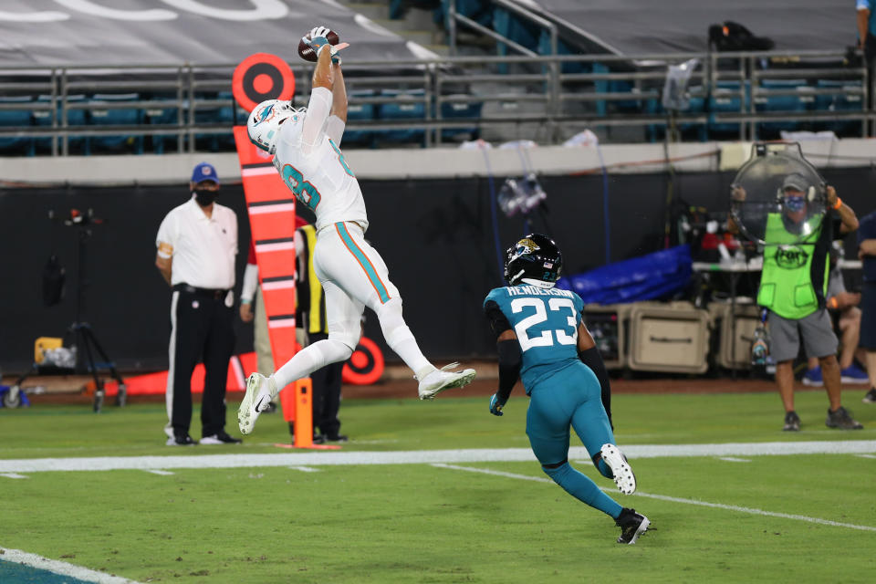 JACKSONVILLE, FL - SEPTEMBER 24: Miami Dolphins Tight End Mike Gesicki (88) catches a pass for a touchdown during the game between the Miami Dolphins and the Jacksonville Jaguars on. September 24, 2020 at TIAA Bank Field in Jacksonville, Fl. (Photo by David Rosenblum/Icon Sportswire via Getty Images)