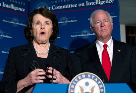 Chairwoman of the Senate Intelligence Committee Senator Dianne Feinstein (D-CA) and committee ranking member Saxby Chambliss (R-GA) speak during a news conference after the closed Senate Intelligence Committee meeting on the attack of the American Consulate in Benghazi, on Capitol Hill in Washington, DC, U.S. on November 15, 2012. REUTERS/Jose Luis Magana/File Photo