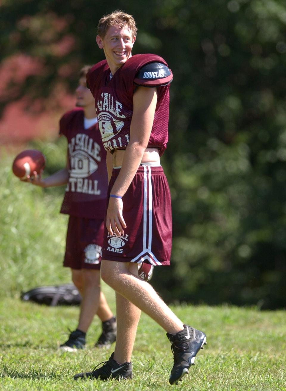 Liam Coen takes a break during a practice at La Salle Academy, where he was coached by his father, Tim Coen.