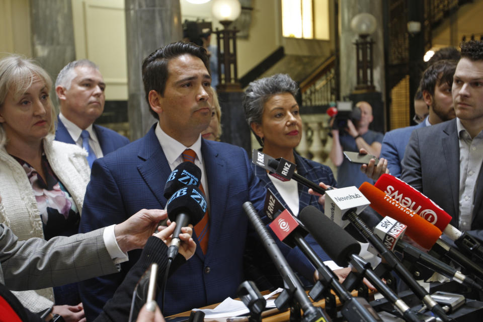 New Zealand opposition leader Simon Bridges speaks to reporters on Tuesday, Oct. 16, 2018, in Wellington, New Zealand. New Zealand's conservative opposition party was in turmoil after one of its own lawmakers, Jami-Lee Ross, accused Bridges of corruption for hiding a donation from a wealthy Chinese businessman.(AP Photo/Nick Perry)