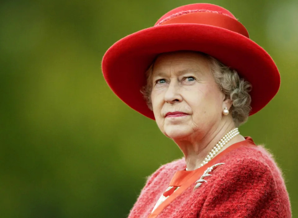 <p>The Queen looks out to the crowd during her visit to Old Brunswick House in Fredericton, New Brunswick, on 11 October 2002. (PA)</p> 