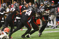 Atlanta Falcons cornerback Dee Alford, second from right, runs an interception during the second half of an NFL football game against the Cleveland Browns, Sunday, Oct. 2, 2022, in Atlanta. The Atlanta Falcons won 23-20. (AP Photo/John Amis)