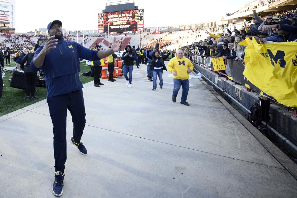 Michigan acting head coach Sherrone Moore reacts after an NCAA college football game against Maryland, Saturday, Nov. 18, 2023, in College Park, Md. Michigan won 31-24. (AP Photo/Nick Wass)