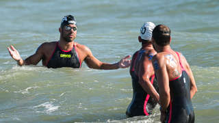 Italy's Dario Verani (L) reacts after competing in the Open Water Mixed 25km event, on August 20, 2022 at Lido di Ostia, southwest of Rome, during the LEN European Aquatics Championships. (Photo by Vincenzo PINTO / AFP)