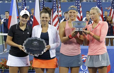 Andrea Hlavackova (R) and Lucie Hradecka of the Czech Republic pose with their winner's trophy as Ashleigh Barty (L) and Casey Dellacqua of Australia pose with their runner's up award after their women's doubles final match at the U.S. Open tennis championships in New York September 7, 2013. REUTERS/Eduardo Munoz
