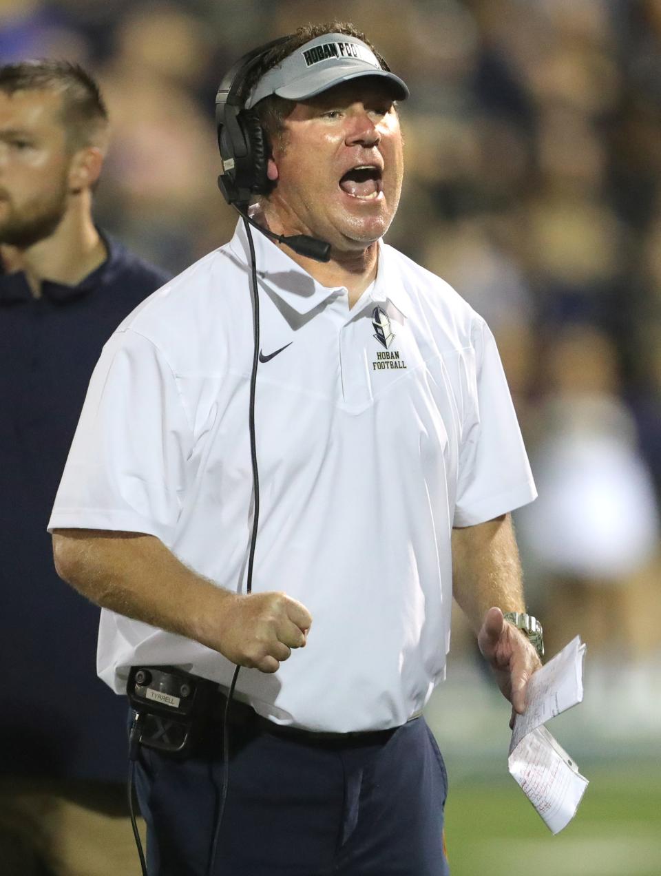 Hoban head coach Tim Tyrrell on the sidelines during the second quarter against St. Vincent-St. Mary on Friday, Oct. 8, 2021.