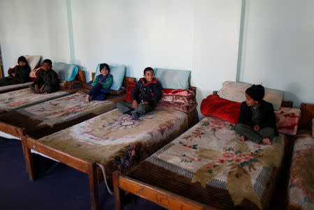 Boys sit on their beds at an orphanage in Sanaa, Yemen, January 2, 2017. REUTERS/Khaled Abdullah