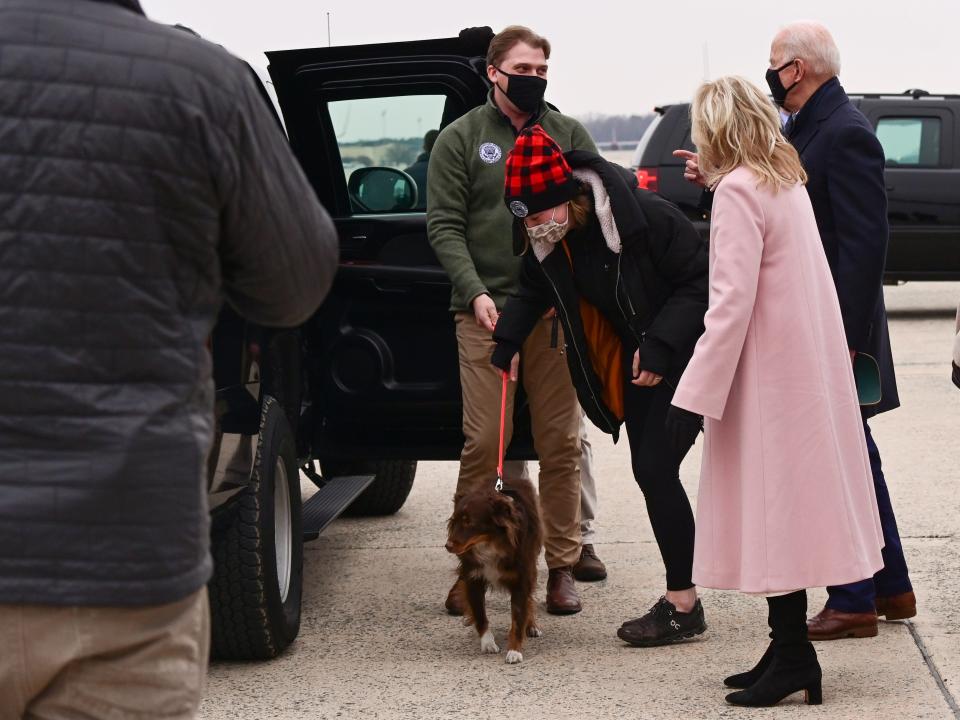 Naomi Biden and Peter Neal manage their dog Charlie with President Joe Biden and Dr. Jill Biden.