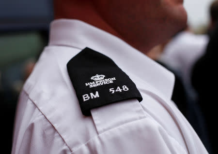 FILE PHOTO: Prison officers attend a meeting outside Birmingham prison in central England April 1, 2011. REUTERS/Darren Staples/File photo