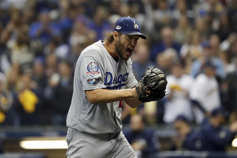 Los Angeles Dodgers starting pitcher Clayton Kershaw (22) yells as he walks off after the third inning of Game 1 of the National League Championship Series baseball game against the Milwaukee Brewers Friday, Oct. 12, 2018, in Milwaukee. (AP)
