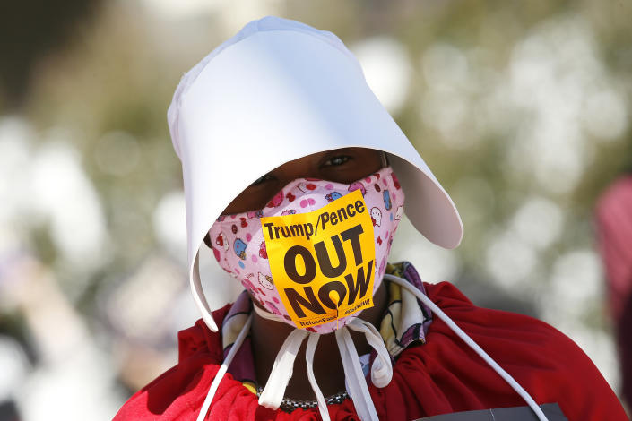 A woman dressed as handmaiden in Washington. (Photo: Paul Morigi via Getty Images)