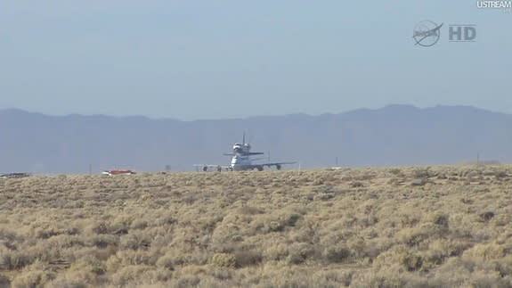 The Shuttle Carrier Aircraft (SCA) carrying shuttle Endeavour pauses on a runway at Edwards Air Force Base, California, on September 21, 2012. Endeavour is headed for its final home at the California Science Center.