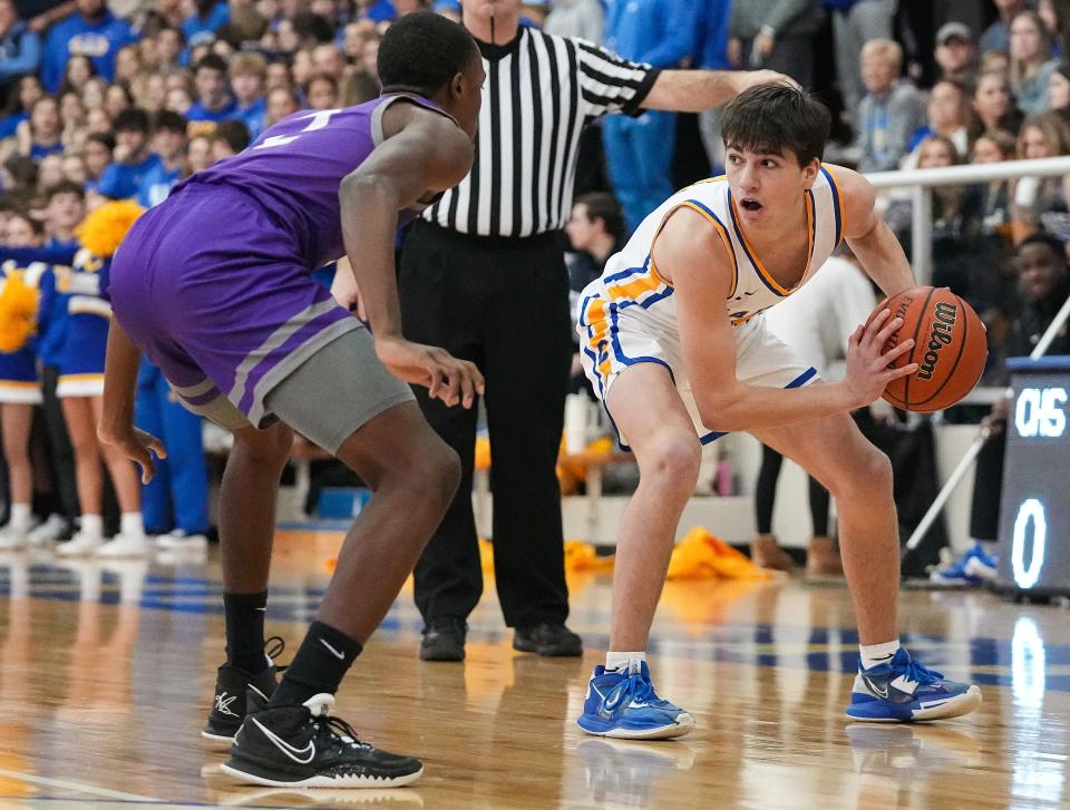 Carmel Greyhounds Alex Couto (3) rushes up the court Friday, Jan. 27, 2023 at Carmel High School in Carmel. The Ben Davis Giants defeated the Carmel Greyhounds, 46-45. 