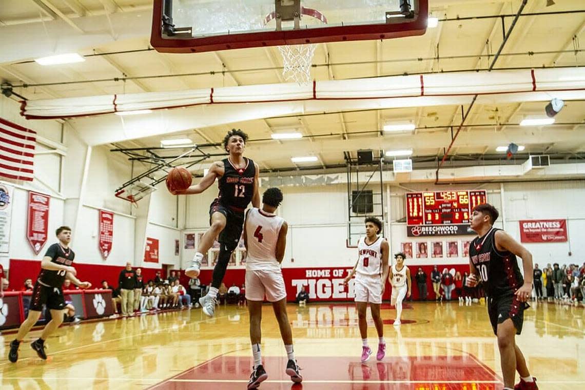 Covington Holy Cross guard Jacob Meyer went up for a shot over Newport’s James Turner earlier this season. Meyer scored 34 points against Hazard on Friday in the All “A” Classic in Richmond.