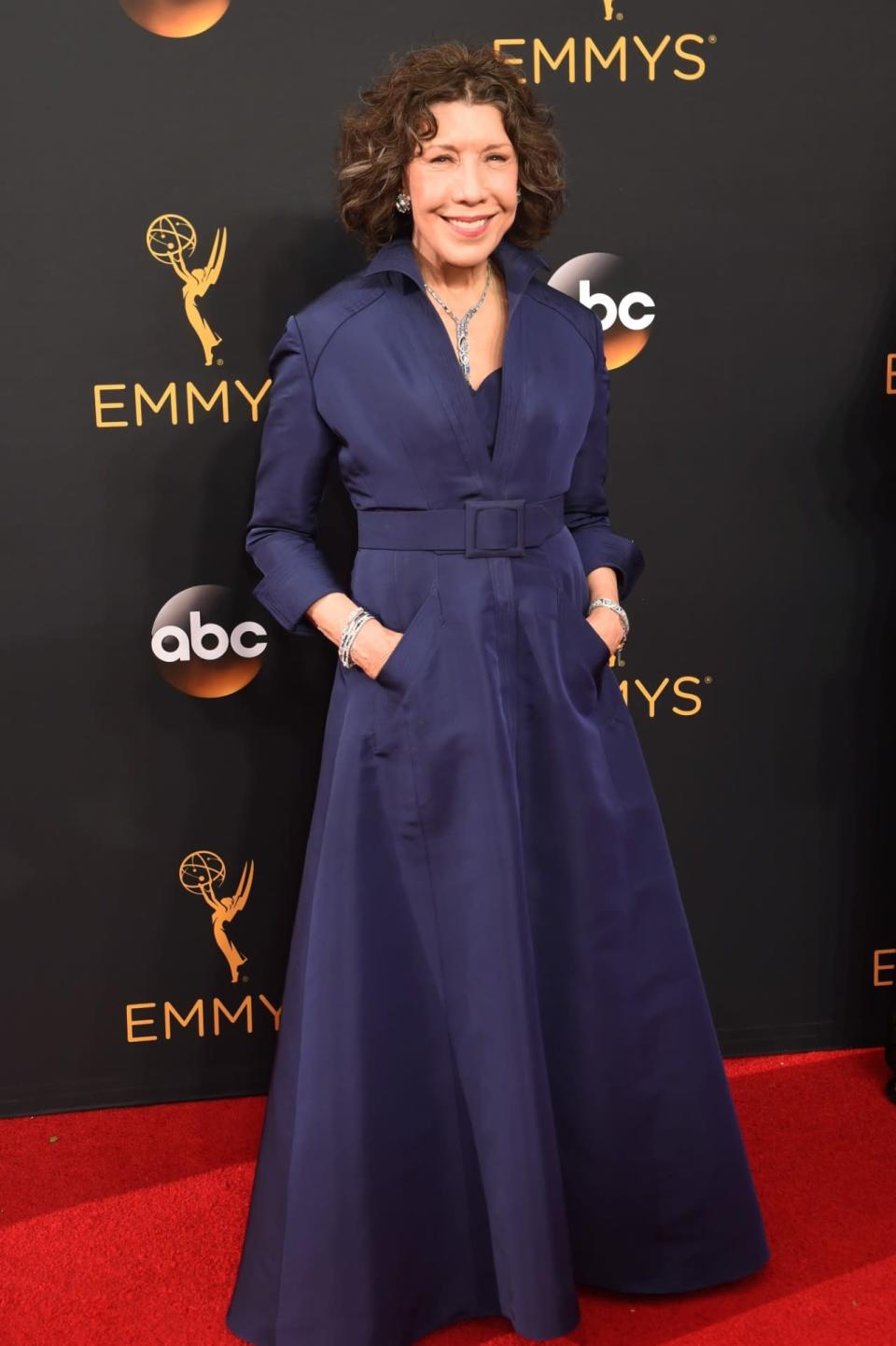 Best: Lily Tomlin in a navy-blue trench coat gown