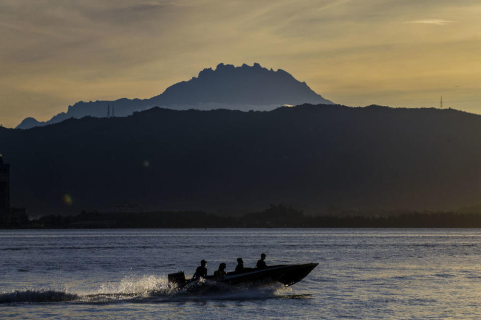 A speedboat passes the Mount Kinabalu September 30, 2020. — Picture by Firdaus Latif