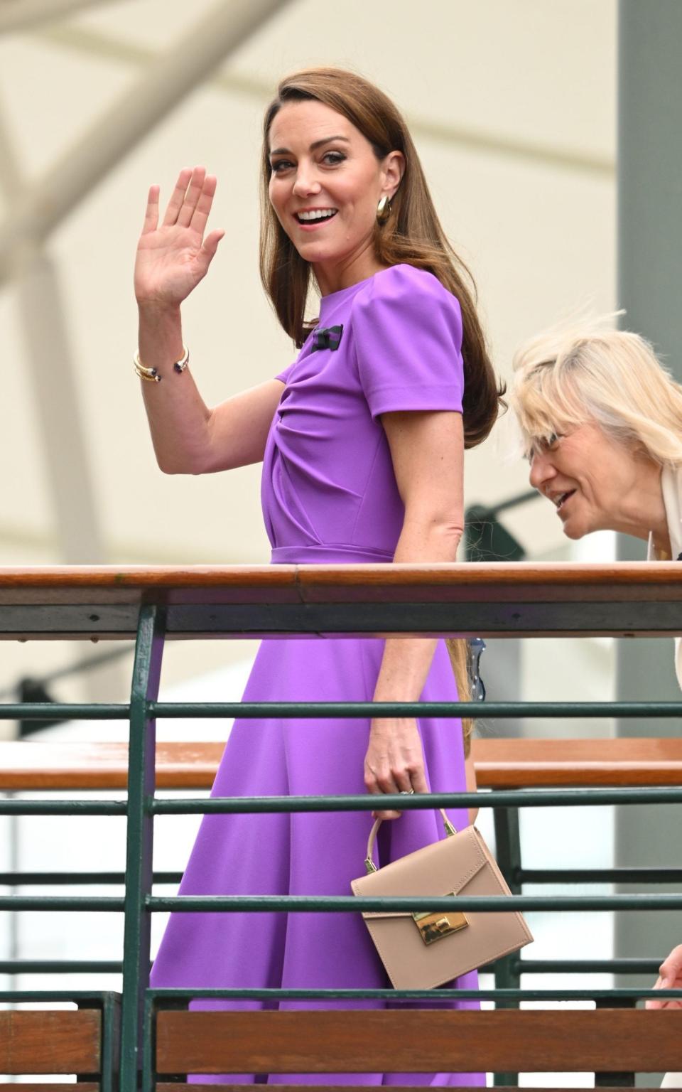 The Princess of Wales smiles and waves as she arrives at Wimbledon