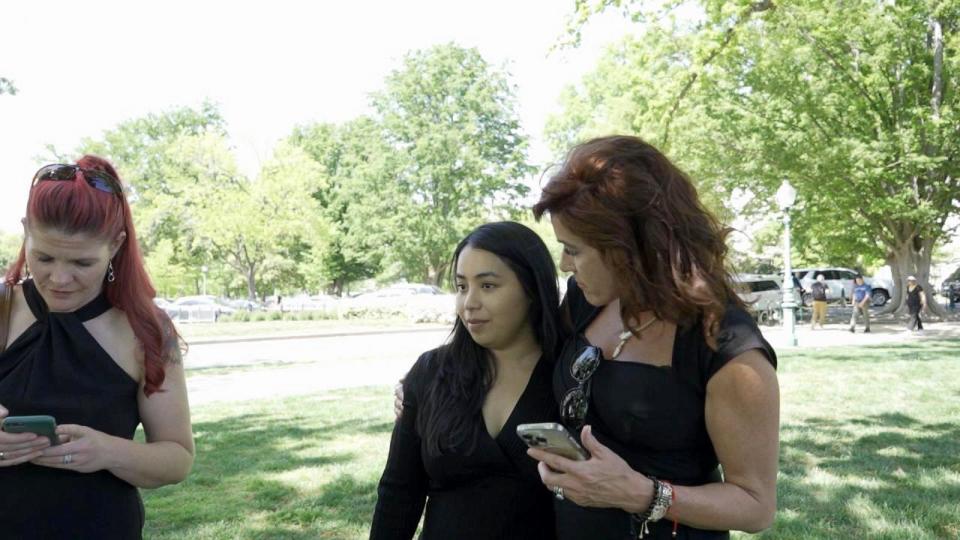 PHOTO: Former Marine Thae Ohu attends a rally with advocates Lindsey Knapp and Amy Braley Franck. (ABC News)