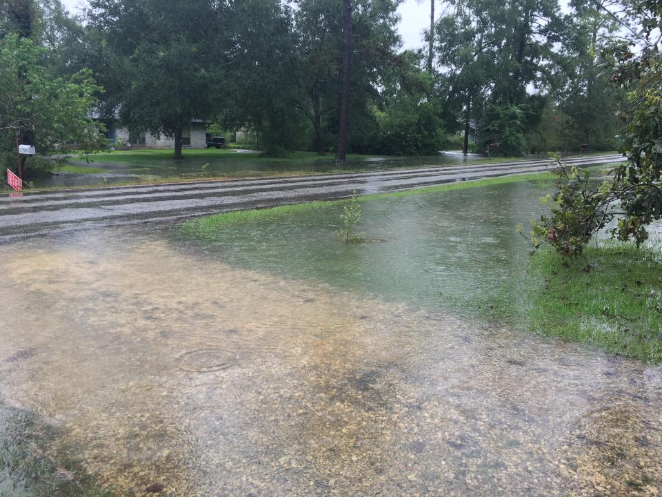 A driveway in Bevil Oaks, Texas, becomes submerged under floodwater amid Hurricane Harvey in August 2017. (Payton Potter, Patch Staff)