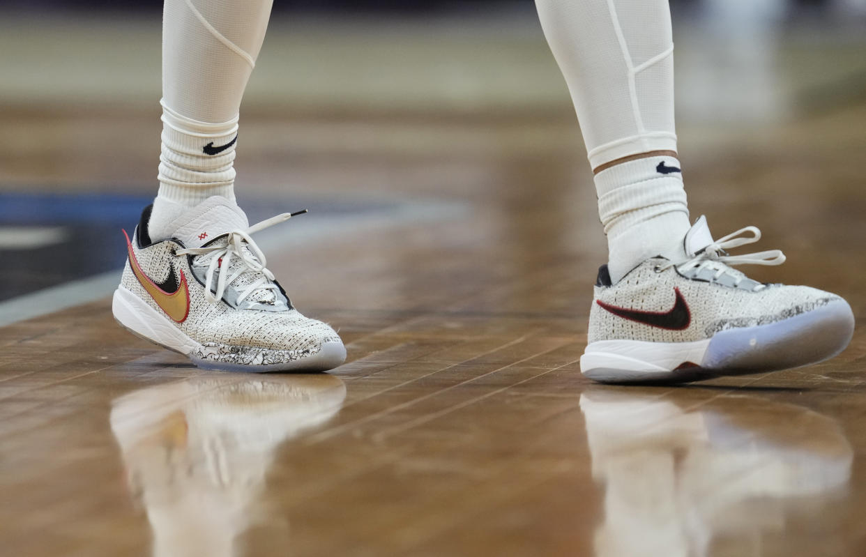 Gonzaga's Anton Watson's shoes in the second half of a second-round college basketball game in the men's NCAA Tournament Sunday, March 19, 2023, in Denver. One of the first things Gongaza forward Anton Watson does when he steps on the court is size up his competition. Their shoes, anyway. (AP Photo/David Zalubowski)