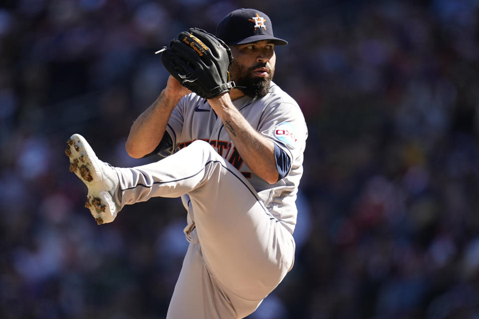 Houston Astros starting pitcher Jose Urquidy winds up to deliver during the first inning of a baseball game against the Minnesota Twins, Friday, April 7, 2023, in Minneapolis. (AP Photo/Abbie Parr)